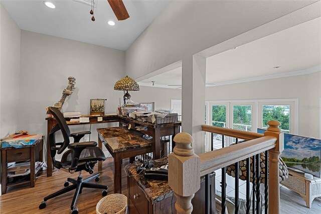 office space with ceiling fan, light hardwood / wood-style flooring, and vaulted ceiling