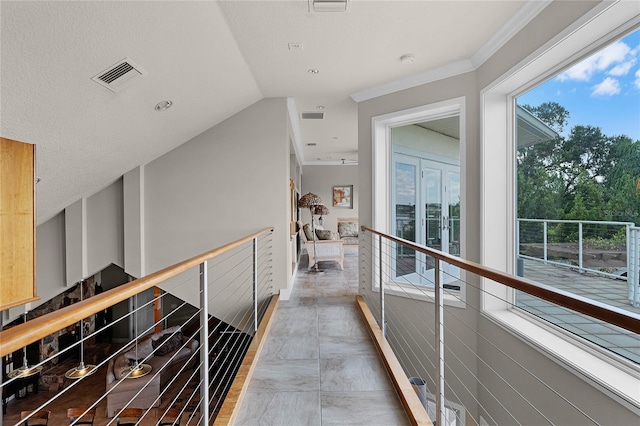 hallway with lofted ceiling and ornamental molding