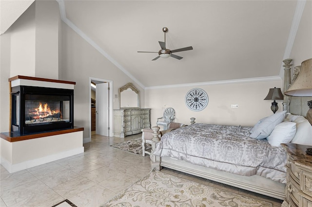 bedroom with ceiling fan, crown molding, and vaulted ceiling