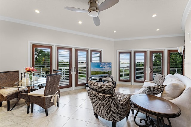 tiled living room with ornamental molding, ceiling fan, french doors, and plenty of natural light