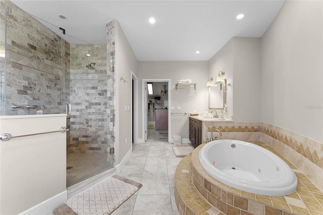 bathroom with tile patterned flooring, vanity, and separate shower and tub