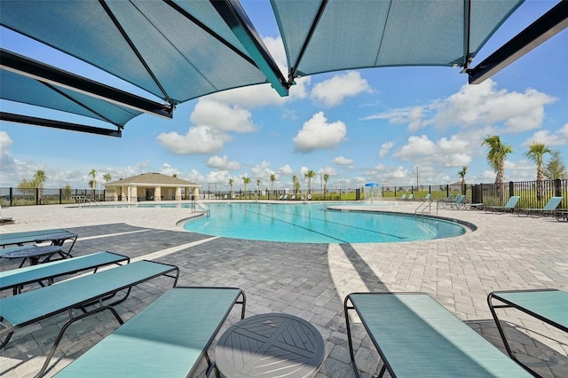 view of swimming pool featuring a patio area