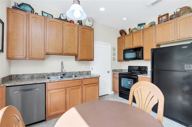 kitchen with visible vents, recessed lighting, a sink, black appliances, and light countertops