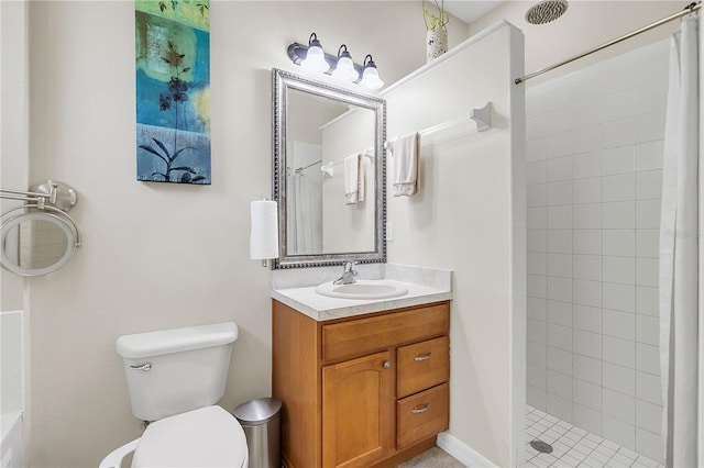 full bathroom featuring toilet, vanity, and a tile shower