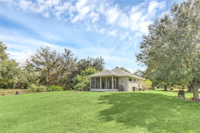 view of yard featuring a sunroom