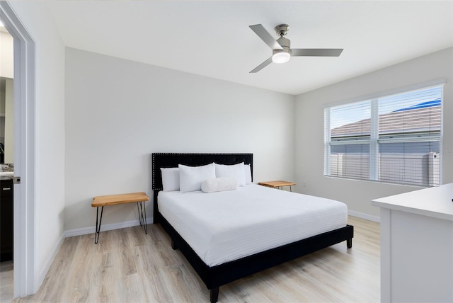 bedroom featuring ceiling fan and light hardwood / wood-style floors