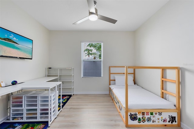 bedroom with ceiling fan and light wood-type flooring