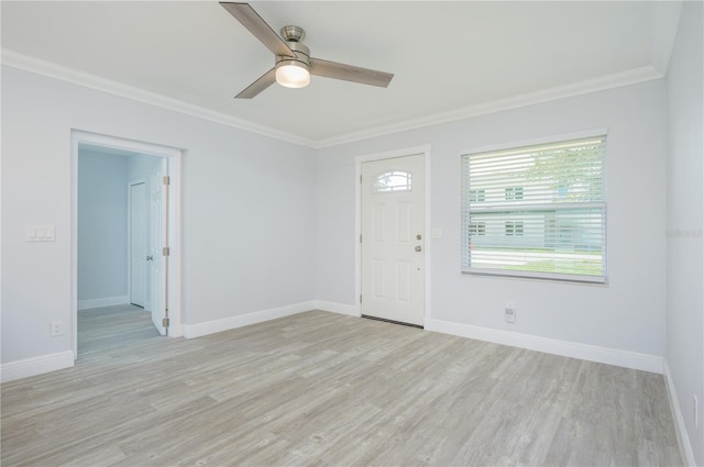 entryway featuring baseboards, ceiling fan, light wood-type flooring, and crown molding