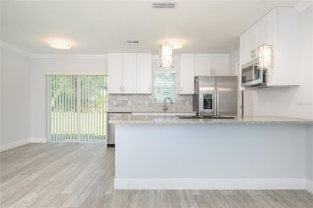 kitchen featuring white cabinetry, light stone countertops, visible vents, and appliances with stainless steel finishes