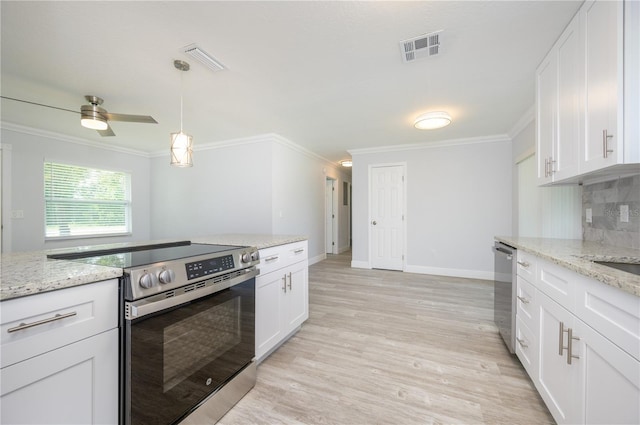 kitchen featuring stainless steel appliances, ornamental molding, white cabinetry, and decorative backsplash