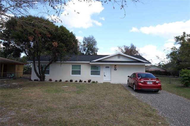 single story home with a front yard