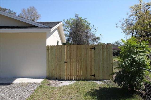 view of gate with fence