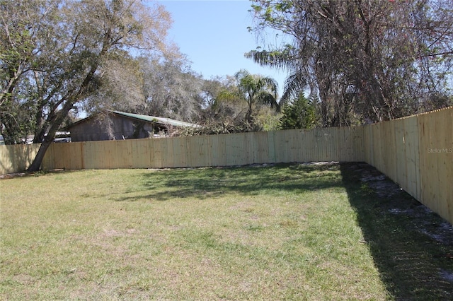 view of yard with a fenced backyard