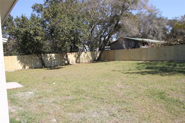 view of yard featuring a fenced backyard