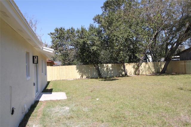 view of yard with a fenced backyard