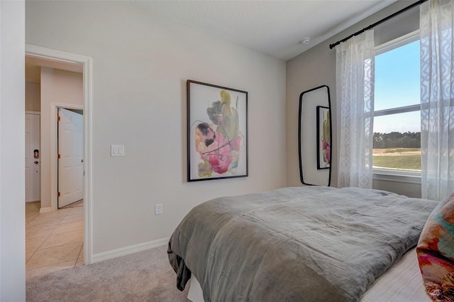 bedroom with light colored carpet