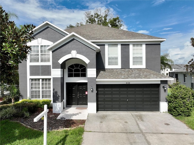 view of front of property featuring a garage