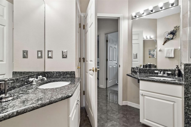 2907 Sunset Lakes Blvd, Kissimmee, FL 34747 - full bath featuring two vanities and baseboards
