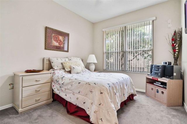 bedroom featuring light colored carpet