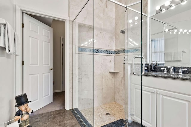 bathroom featuring vanity, tile patterned flooring, and an enclosed shower