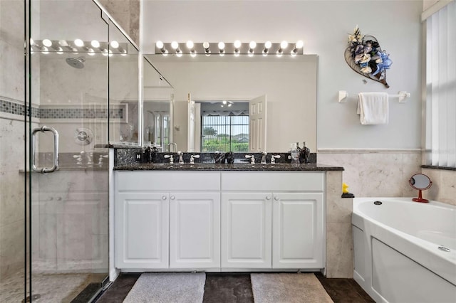 2907 Sunset Lakes Blvd, Kissimmee, FL 34747 - bathroom with a stall shower, double vanity, and a bath