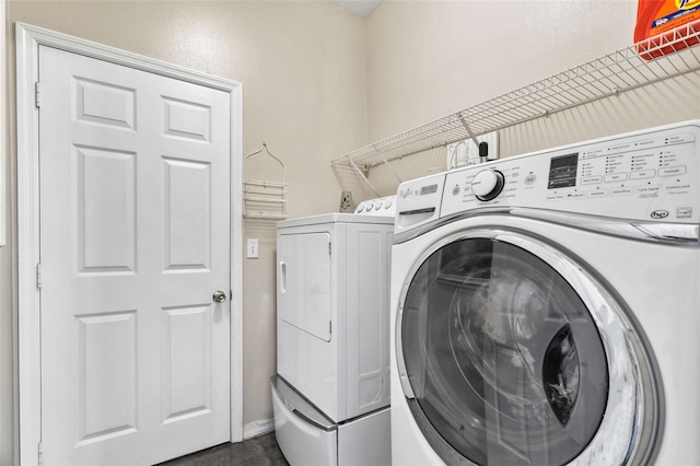 washroom featuring washing machine and dryer