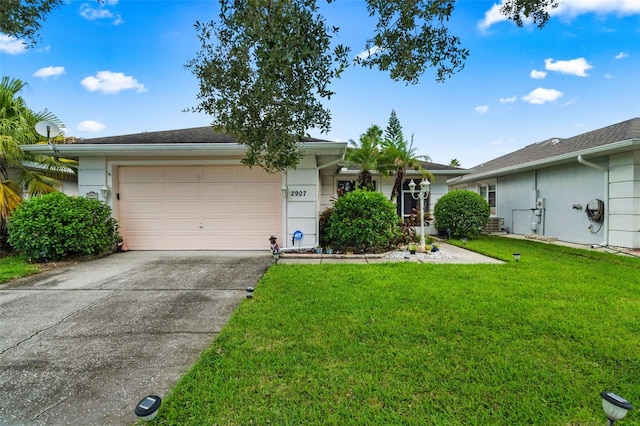 ranch-style home featuring a front lawn, central air condition unit, and a garage