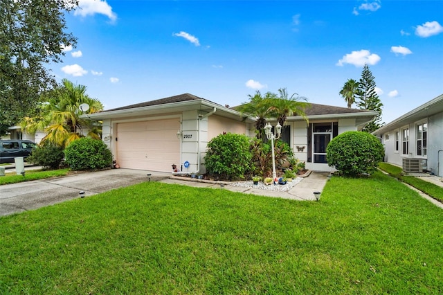 ranch-style house with a garage, central AC, and a front yard