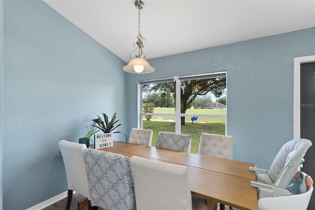 dining area with vaulted ceiling