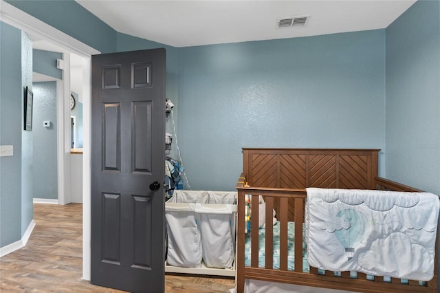 bedroom featuring wood-type flooring