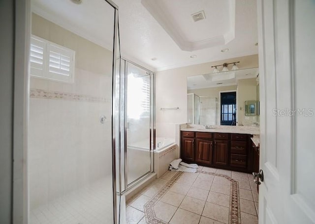 bathroom with vanity, separate shower and tub, tile patterned flooring, and a raised ceiling