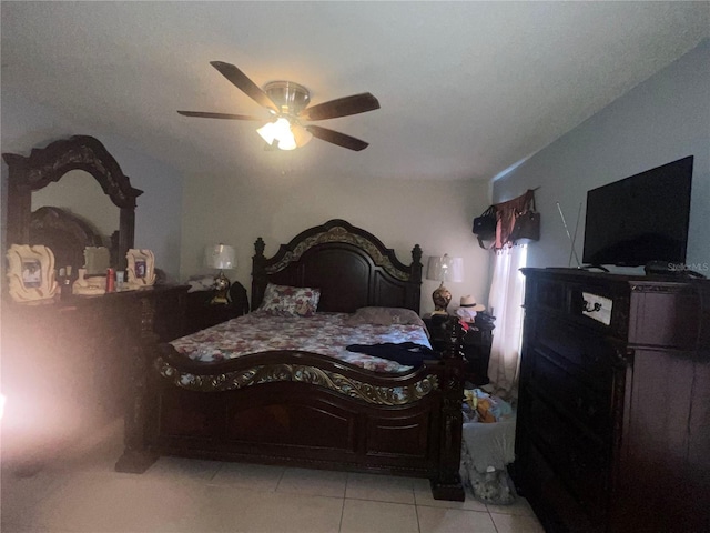 tiled bedroom with ceiling fan