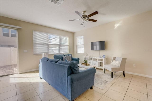 living room featuring light tile patterned flooring and ceiling fan