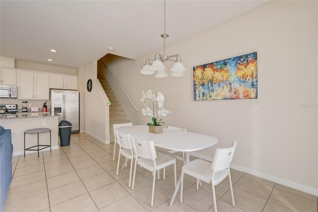 dining space featuring a chandelier and light tile patterned floors