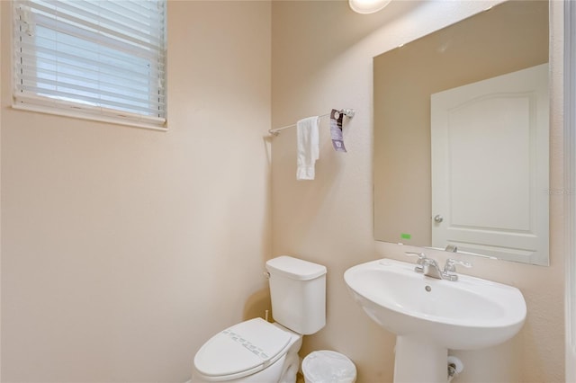 bathroom with toilet and sink