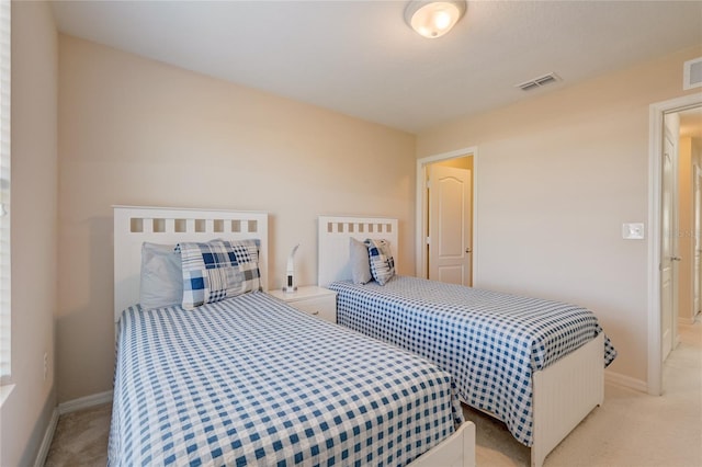 bedroom featuring light colored carpet