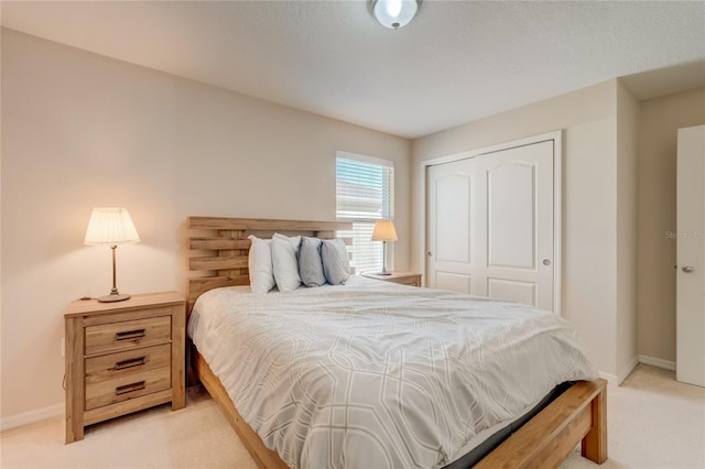 carpeted bedroom with a closet