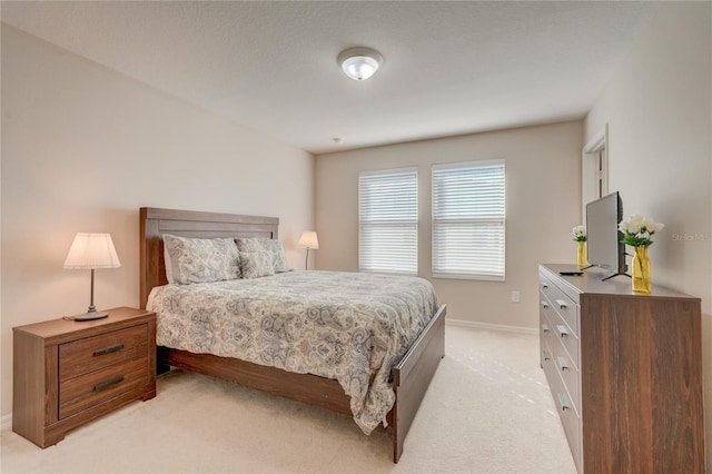 bedroom with light colored carpet