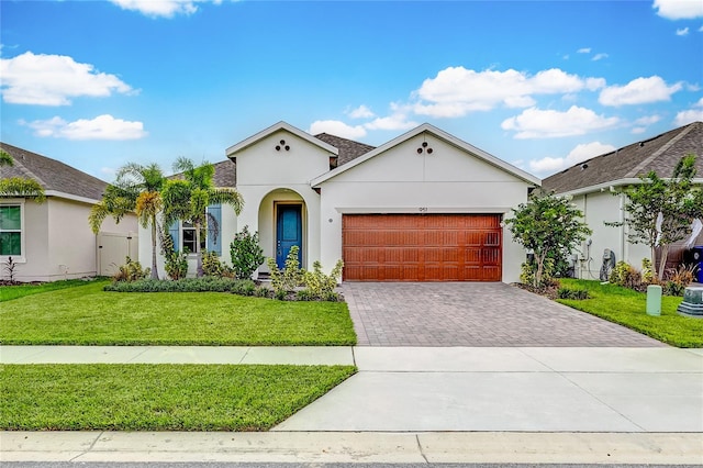 view of front of house featuring a garage and a front yard