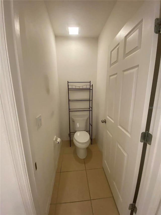 bathroom with tile patterned floors and toilet