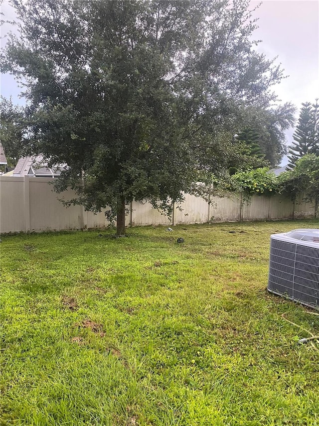 view of yard with central air condition unit