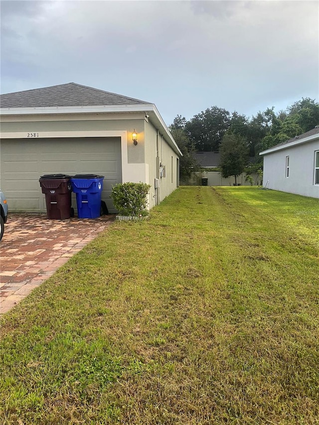 view of yard with a garage