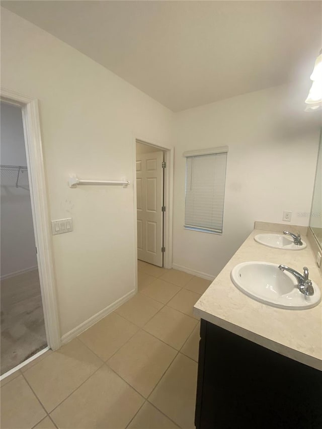 bathroom with vanity and tile patterned flooring