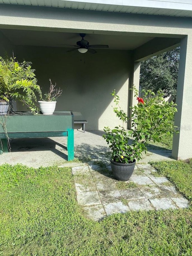 view of patio featuring ceiling fan