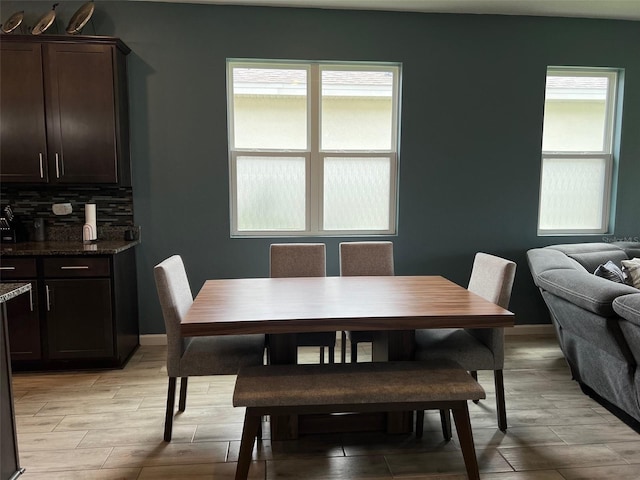 dining space with light hardwood / wood-style floors