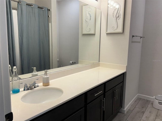 bathroom with wood-type flooring and vanity