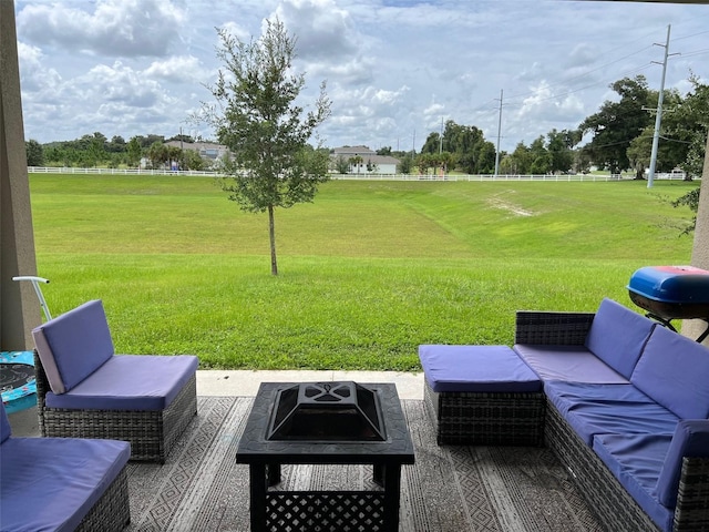 exterior space featuring an outdoor living space with a fire pit