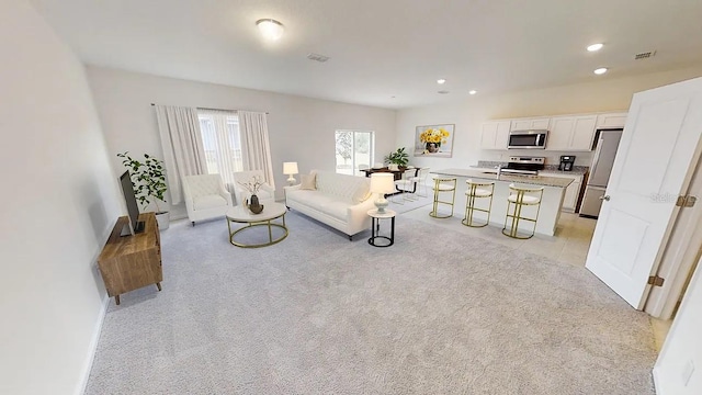 living room with light colored carpet