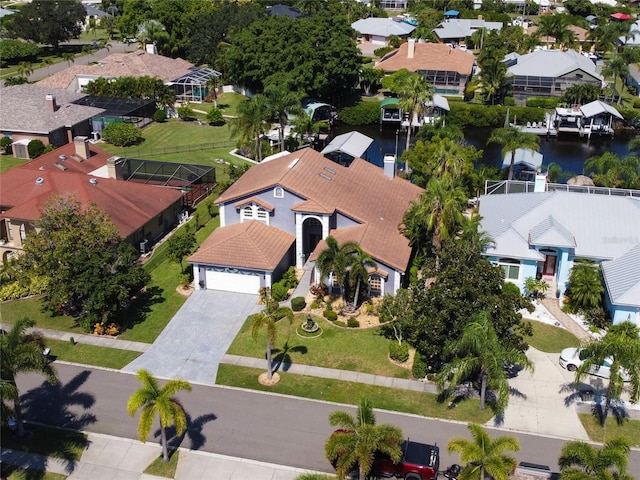 birds eye view of property with a water view