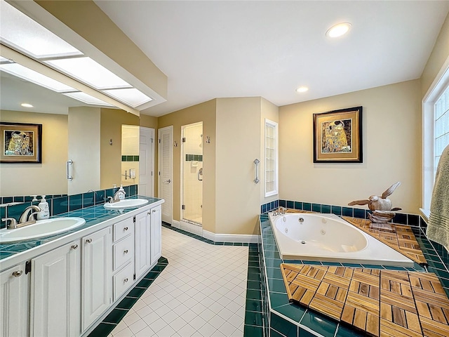 bathroom featuring tile patterned floors, independent shower and bath, and vanity